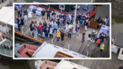 Luftaufnahme einer Schulklasse auf einem Anleger im Hafen